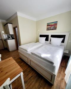 Ένα ή περισσότερα κρεβάτια σε δωμάτιο στο Marcel Apartments Leipzig