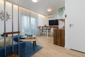 TV a/nebo společenská místnost v ubytování Horizon Park Apartment by Noclegi Renters