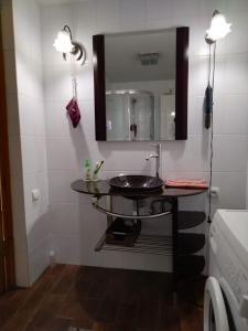 a bathroom with a sink and a mirror at Квартира у моря в Абхазии Сухум in Sukhum