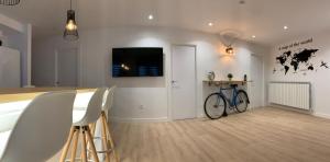 a living room with a bike on the wall at APARTAMENTOS SANTULLANO 2 in Oviedo