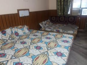 Postel nebo postele na pokoji v ubytování Hotel Rajpal Guest House