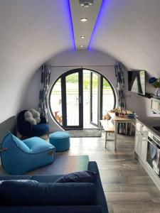 a living room with a blue ceiling at Derecroft Glamping Luxury Lodgepods in Lanchester