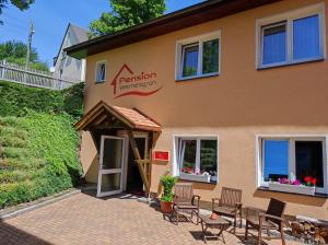 a building with a pavilion in front of it at Pension Wernesgrün in Wernesgrün