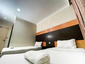 Postel nebo postele na pokoji v ubytování Grand Hotel
