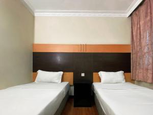 Postel nebo postele na pokoji v ubytování Grand Hotel