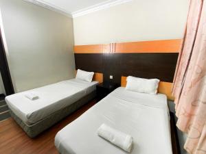 Postel nebo postele na pokoji v ubytování Grand Hotel