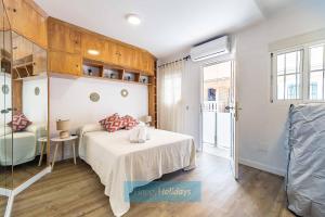 A bed or beds in a room at HH Casa Chica