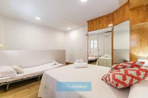 A bed or beds in a room at HH Casa Chica