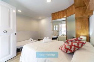 A bed or beds in a room at HH Casa Chica