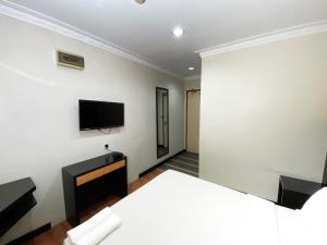 TV a/nebo společenská místnost v ubytování Grand Hotel