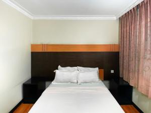 Postel nebo postele na pokoji v ubytování Grand Hotel