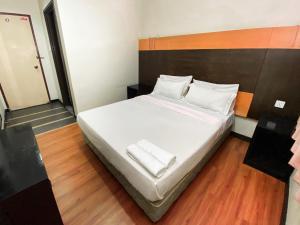 Postel nebo postele na pokoji v ubytování Grand Hotel