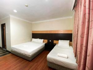 Postel nebo postele na pokoji v ubytování Grand Hotel