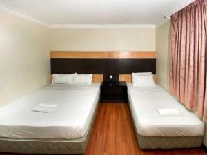 Un pat sau paturi într-o cameră la Grand Hotel