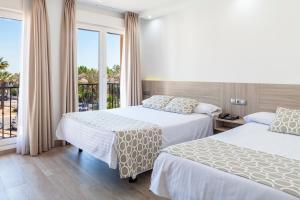 Posteľ alebo postele v izbe v ubytovaní Hotel Olympia Ronda II + 37 fotografií