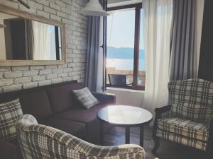 Uma área de estar em Forte Rose Hotel