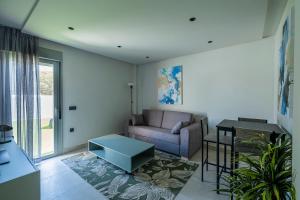 a living room with a couch and a table at ON City Apartments in Matalascañas
