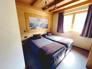 Posteľ alebo postele v izbe v ubytovaní Carosello Lodge Livigno