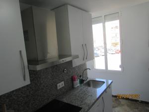 A kitchen or kitchenette at LOPEZ DE GOMARA 57