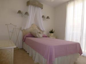 A bed or beds in a room at ATiCO DUPLEX CERCA DE LA PLAYA