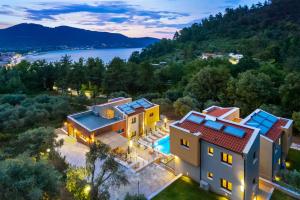 an aerial view of a house with a swimming pool at Serenity Apartments in Skala Potamias