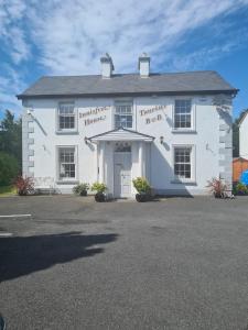 a white building with the front of it at Innisfree Guest House in Sligo