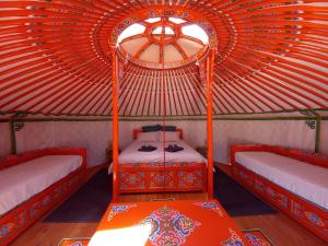 a room with two beds in a yurt at A Ventoux Yourte in Monieux
