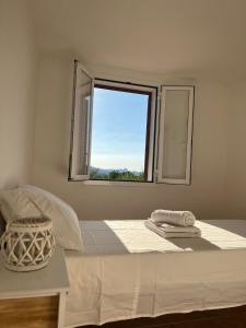 A bed or beds in a room at Coralli 8 - Residence Sole Ruju Még 27 kép