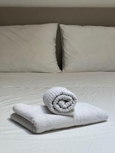 A bed or beds in a room at Coralli 8 - Residence Sole Ruju