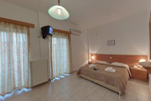 Posteľ alebo postele v izbe v ubytovaní Marirena Hotel