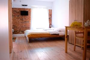 Ein Bett oder Betten in einem Zimmer der Unterkunft Przystawy Agroturystyka