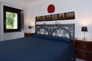 Кровать или кровати в номере Bella Baia Relais