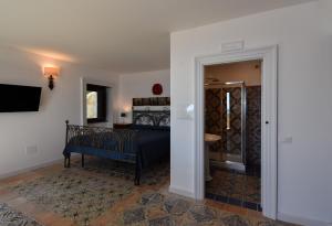 Кровать или кровати в номере Bella Baia Relais