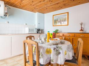 a kitchen with a table with a bowl of food on it at Holiday Home Canétoise Tixador by Interhome in Canet-en-Roussillon