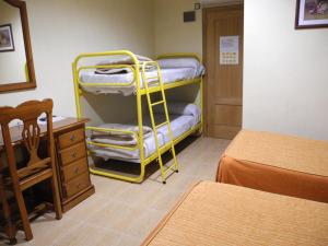 Postel nebo postele na pokoji v ubytování Hotel Beatriz