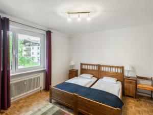 Postel nebo postele na pokoji v ubytování Apartment Haus Grani by Interhome