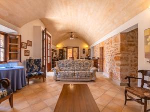a living room with a couch and a table at Holiday Home Moli de Son Vidal by Interhome in Santanyi +50 photos