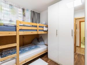 a bunk bed room with a bunk bed in a room at Apartment Appartement Andrea by Interhome in Grünholzer