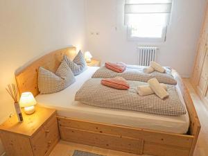 a bedroom with two beds with pillows on them at Apartment Föhrenheim - SFE201 by Interhome in Leutasch