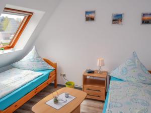 Un pat sau paturi într-o cameră la Apartment Janßen by Interhome