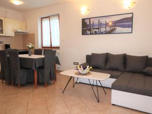 a living room with a couch and a table at Holiday Home Andrea - LBN415 by Interhome in Labin