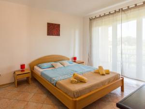 Ένα ή περισσότερα κρεβάτια σε δωμάτιο στο Apartment Giuliano-4 by Interhome