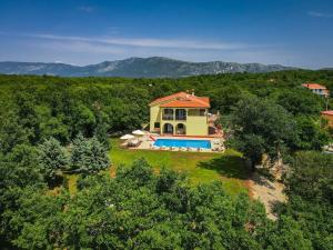 an aerial view of a house with a swimming pool at Holiday Home Villa Tanne - LBN427 by Interhome in Labin