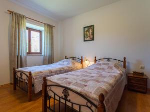 Posteľ alebo postele v izbe v ubytovaní Holiday Home Verbanac by Interhome