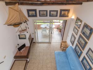a living room with a blue couch and a table at Apartment Spinnaker by Interhome in Palau