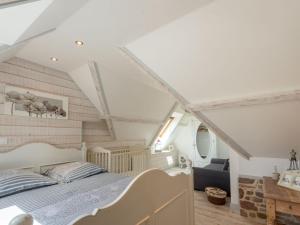 a bedroom with a bed in a attic at Holiday Home Zoé - CEZ407 by Interhome in Créances