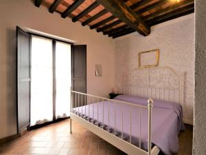 A bed or beds in a room at Apartment Pian dei Carpini - Janis by Interhome