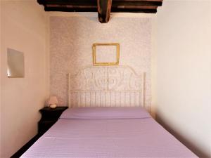 A bed or beds in a room at Apartment Pian dei Carpini - Janis by Interhome