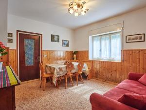 a dining room with a table and chairs at Apartment Marta by Interhome in Gera Lario