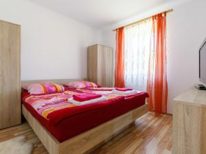 A bed or beds in a room at Holiday Home Paola by Interhome